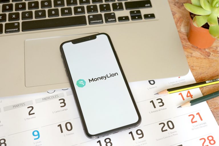 Madrid, Spain - April 20, 2020; MoneyLion Iphone Screen with Macbook and Calendar. MoneyLion is a private fintech company. #MoneyLion moneylion review