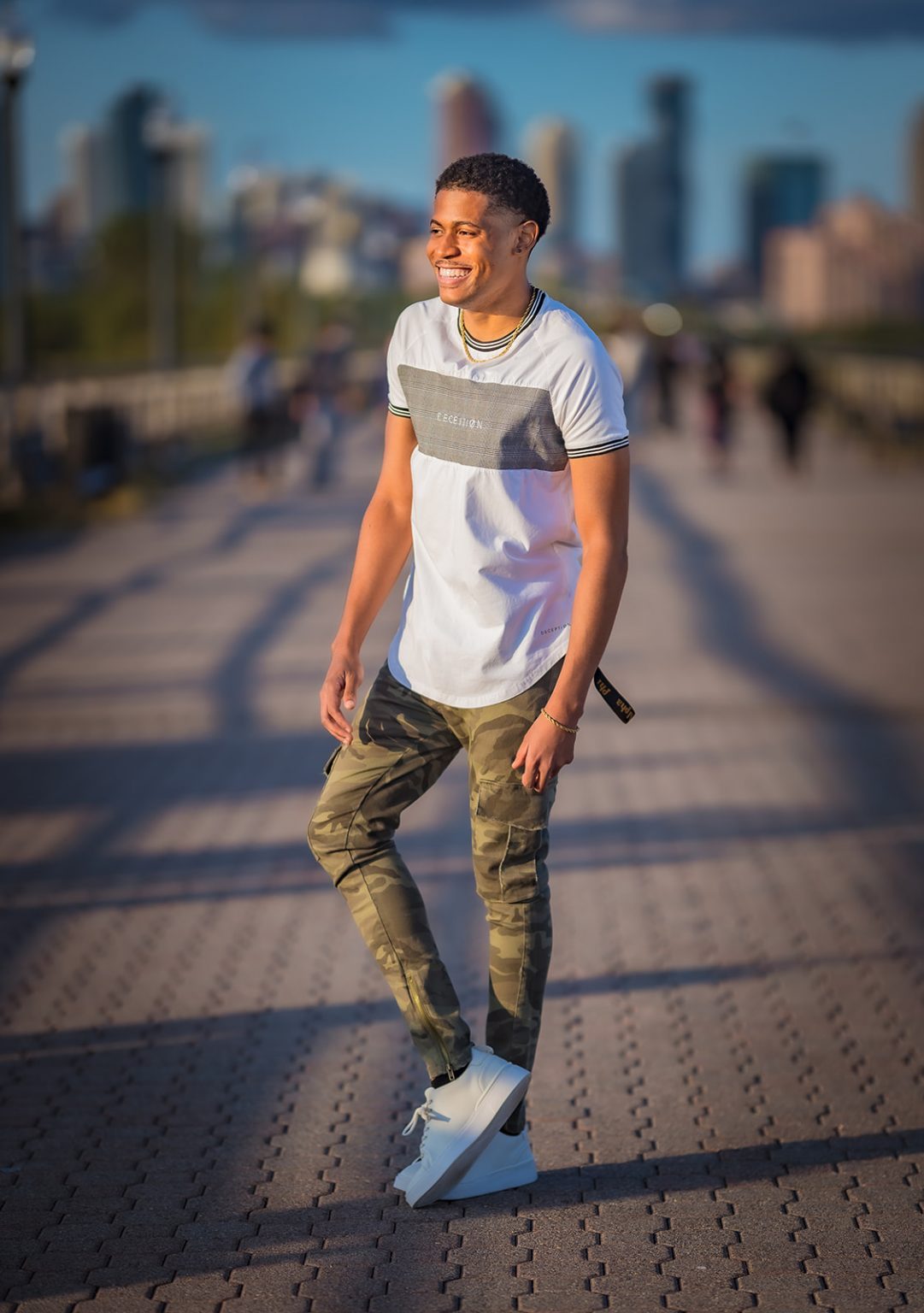 Tyler Jurelle sporting a streetwear look with Deception Toronto apparel and Zara sneakers, photographed by Aaron Robinson in Jersey City.
