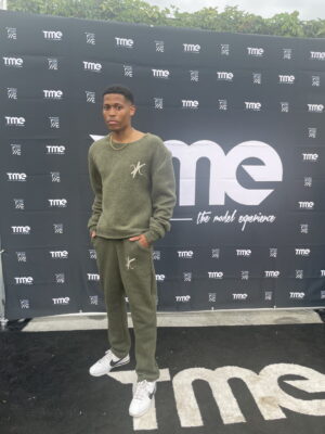 The final moments of preparation before stepping onto the runway in Vaughn Acquis’s wool set.