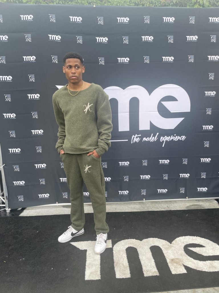 A glimpse behind the curtain at New York Fashion Week, Tyler is wearing Vaughn Acquis’s khaki green set.
