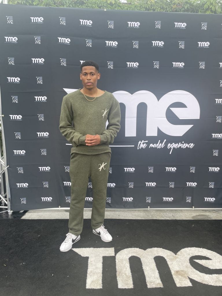 New York model Tyler Jurelle is preparing to step into the spotlight at New York Fashion Week, dressed in Vaughn Acquis’s collection.