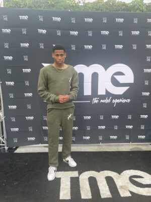 Poised and ready before stepping onto the catwalk, Tyler Jurelle, a New York-based male model, is dressed in Vaughn Acquis’s wool set.