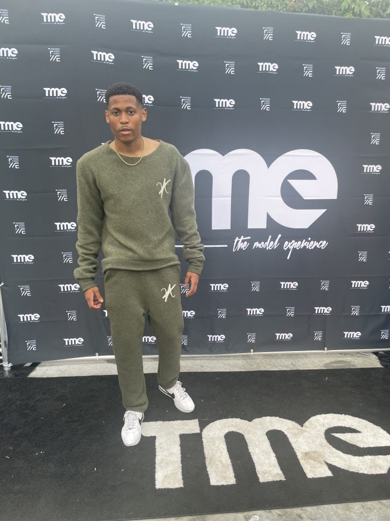 Reflecting on the experience, Tyler Jurelle is wearing Vaughn Acquis’s khaki green wool set.