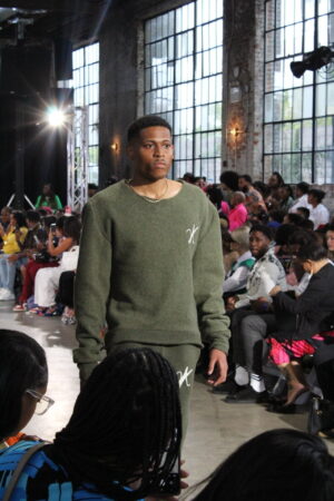 Each step is precise and purposeful on the runway; The Model Experience showcases Vaughn Acquis’s craftsmanship.