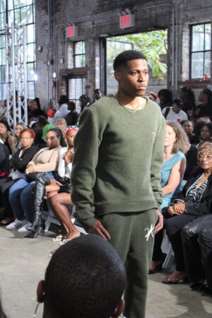 Tyler Jurelle displays a strong and stylish walk down the runway while representing Vaughn Acquis at New York Fashion Week.