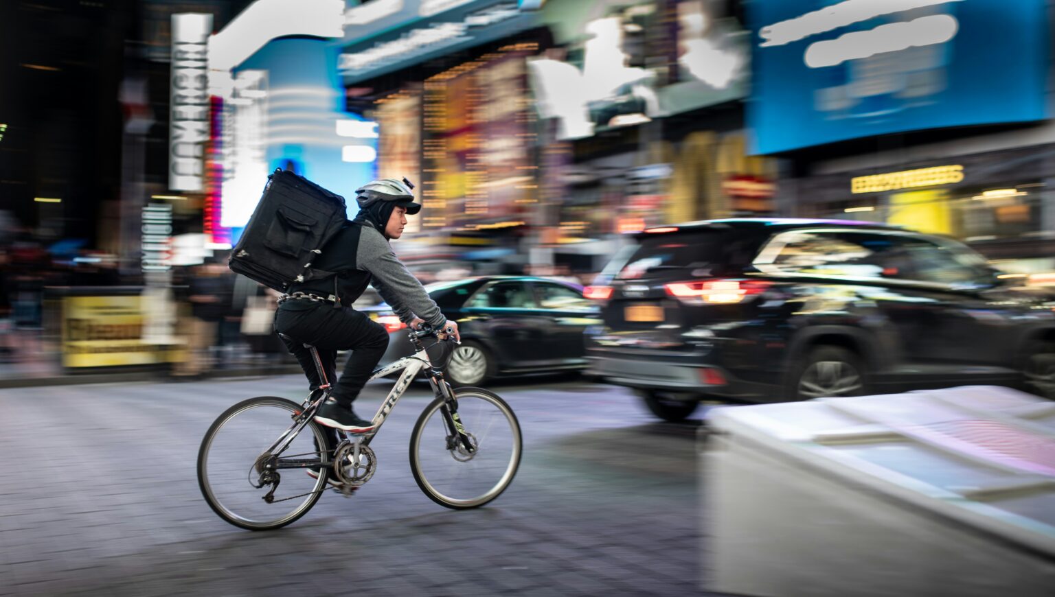 A photo of a man delivering food in New York City.