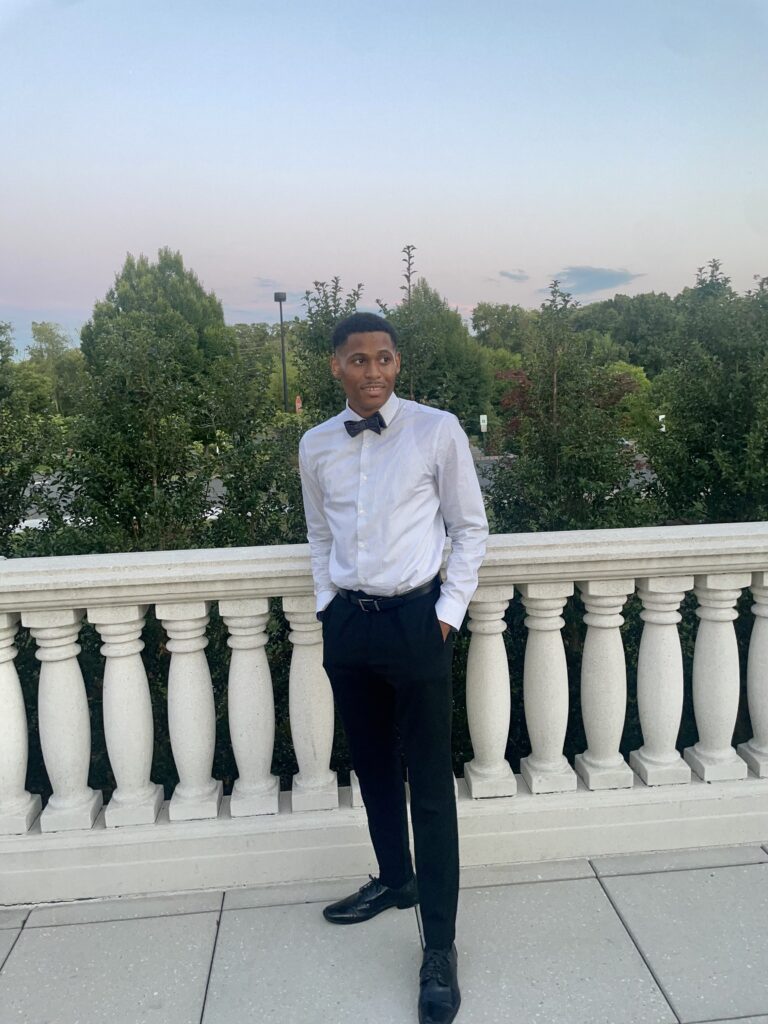 Tyler Jurelle is event-ready, opting for a smart look without the blazer, highlighting his shirt and bow tie.