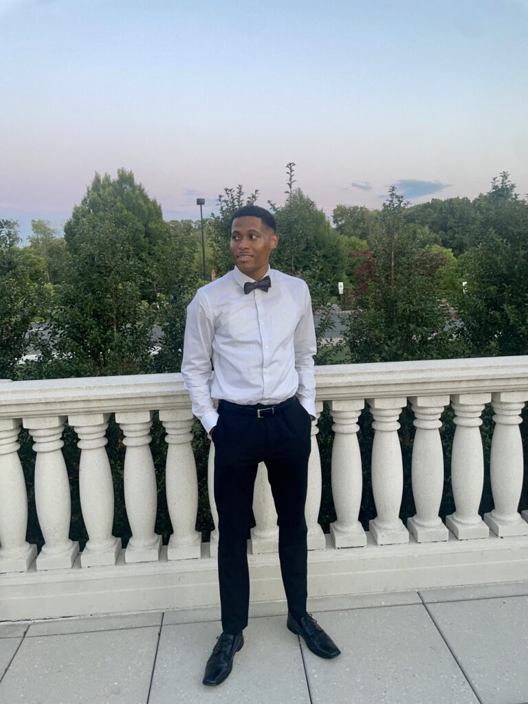 Showing elegant simplicity, Tyler Jurelle steps out without the jacket, focusing on the bow tie and shirt.