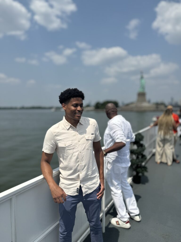Capturing the calm as Tyler Jurelle sails through the New York City Harbor, embracing the peaceful vibes of the water.