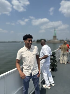 Capturing the calm as Tyler Jurelle sails through the New York City Harbor, embracing the peaceful vibes of the water.
