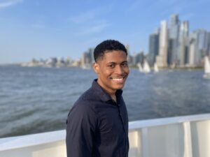Creator Tyler Jurelle is enjoying an afternoon on the Circle Line Sightseeing Cruises with the NYC skyline behind them.