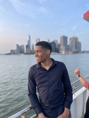 Tyler Jurelle is gazing at the sunset over the NYC skyline while on a Circle Line Sightseeing Cruise.