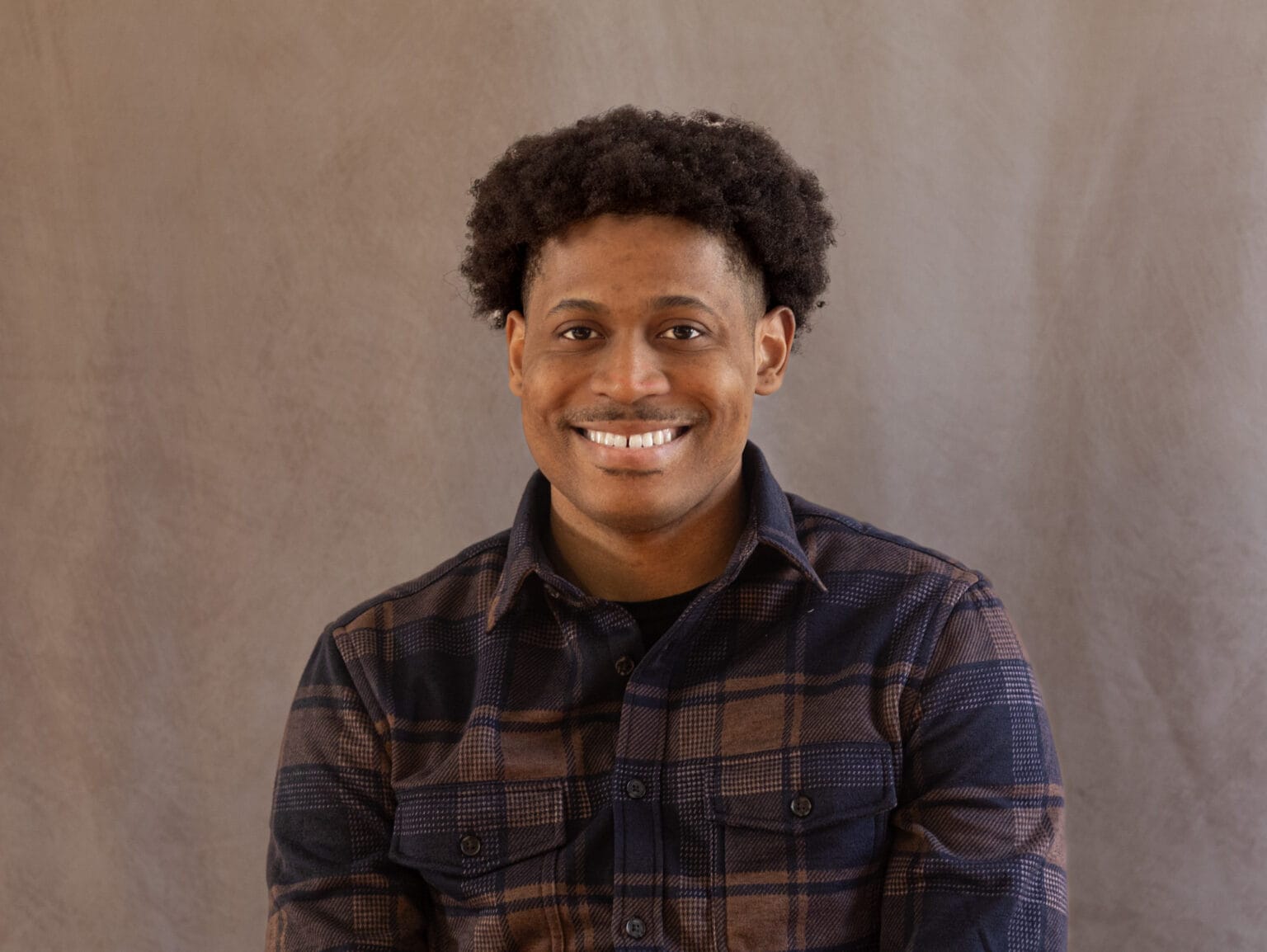 Tyler Jurelle, men's fashion model and entrepreneur, in a professional headshot.